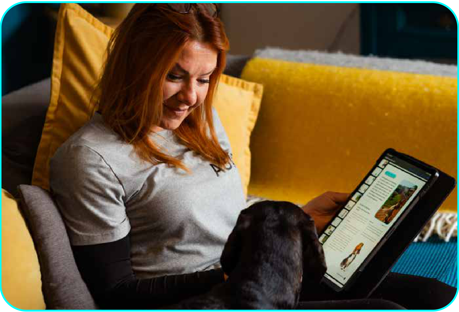 Laura reading with a dog at home